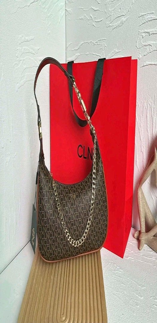 CLN Monogram Shoulder Bag with Gold Chain (Category: Luxury Bags & Wallets) located in Manila. Submitted by silvermoon_b802e0 (Listing ID 1470961368, Image 1). Description: - Brand: CLN - Design: Dark brown all-over monogram print with a structured curved bottom - Hardware: Trendy chunky gold chain accent in front - Straps: Short shoulder strap for comfortable wear - Condition: Brand new with tag still attached - Inclusion: Comes with the origina