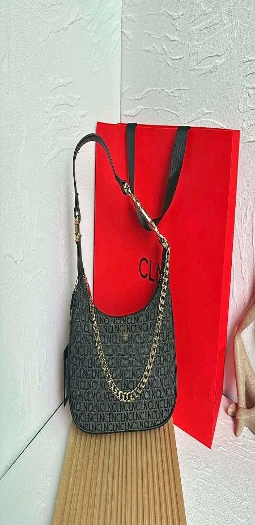CLN Monogram Shoulder Bag with Gold Chain (Category: Luxury Bags & Wallets) located in Manila. Submitted by silvermoon_b802e0 (Listing ID 1470961368, Image 2). Description: - Brand: CLN - Design: Dark brown all-over monogram print with a structured curved bottom - Hardware: Trendy chunky gold chain accent in front - Straps: Short shoulder strap for comfortable wear - Condition: Brand new with tag still attached - Inclusion: Comes with the origina