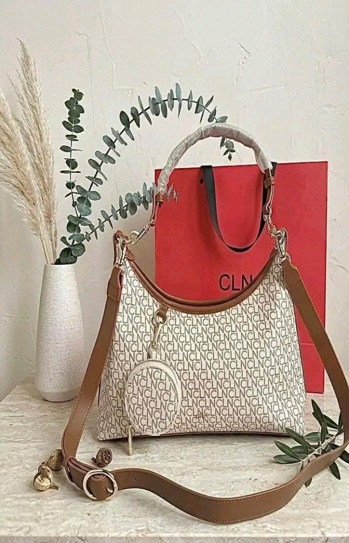 CLN Monogram Shoulder Bag with Coin Purse (Category: Luxury Bags & Wallets) located in Manila. Submitted by silvermoon_b802e0 (Listing ID 1470961779, Image 1). Description: - Brand: CLN - Design: Classic brown and cream monogram pattern - Includes: Matching mini round coin purse attached to the front ring - Straps: Brown adjustable shoulder strap and top handle (wrapped in protective plastic) - Freebie: Authentic red CLN paper shopping bag includ
