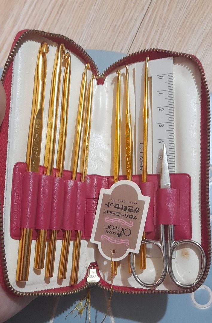 Clover Gold Crochet Hook Set in Red Case (Category: Craft Supplies & Tools) located in Bocaue. Submitted by marajapansurplus (Listing ID 1470977701, Image 1). Description: - Authentic gold-toned Clover crochet hook complete set - Includes multiple hook sizes for all your project needs - Comes with a pair of small scissors and a measuring gauge ruler - Neatly organized in individual slots inside a compact red zippered storage case - Features Japan