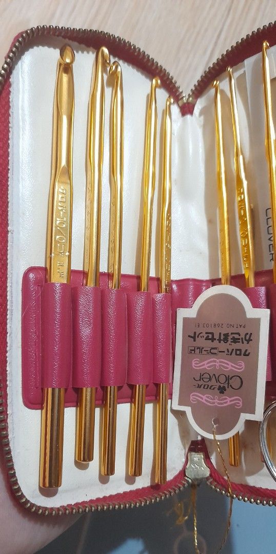 Clover Gold Crochet Hook Set in Red Case (Category: Craft Supplies & Tools) located in Bocaue. Submitted by marajapansurplus (Listing ID 1470977701, Image 2). Description: - Authentic gold-toned Clover crochet hook complete set - Includes multiple hook sizes for all your project needs - Comes with a pair of small scissors and a measuring gauge ruler - Neatly organized in individual slots inside a compact red zippered storage case - Features Japan