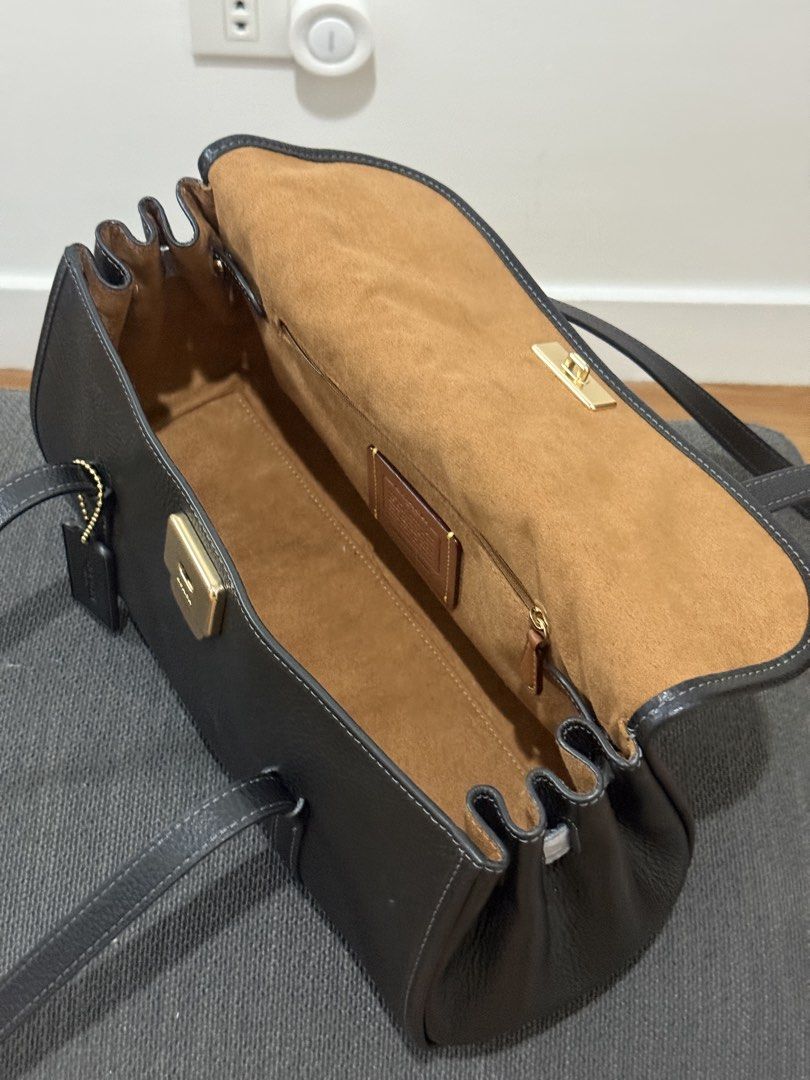 Coach Bridget Flap Shoulder Bag (Category: Shoulder Bags) located in Paranaque City. Submitted by sofiagillegean (Listing ID 1471042505, Image 3). Description: Selling for ₱17,990 (negotiable) Original Coach price: ₱32,000 Brand new and never used. Purchased directly from the Coach Outlet store. Selling because I accidentally bought two of the same bag. Details: • Authentic Coach • Refined pebble leather • Fabric lining • Length: 13.5” • Height: 