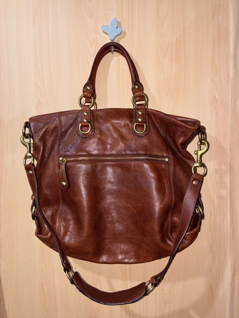 Coach Brown Leather Shoulder Bag Tote (Category: Luxury Bags & Wallets) located in Placer. Submitted by talaalond61563 (Listing ID 1471064890, Image 3). Description: - Authentic Coach Madison Julianne 2-way satchel and shoulder bag leather handbag in rich brown - Dual top handles and adjustable/removable shoulder strap - Classic brass hardware with iconic horse & carriage logo plate - Convenient exterior back zip pocket - Spacious interior with a