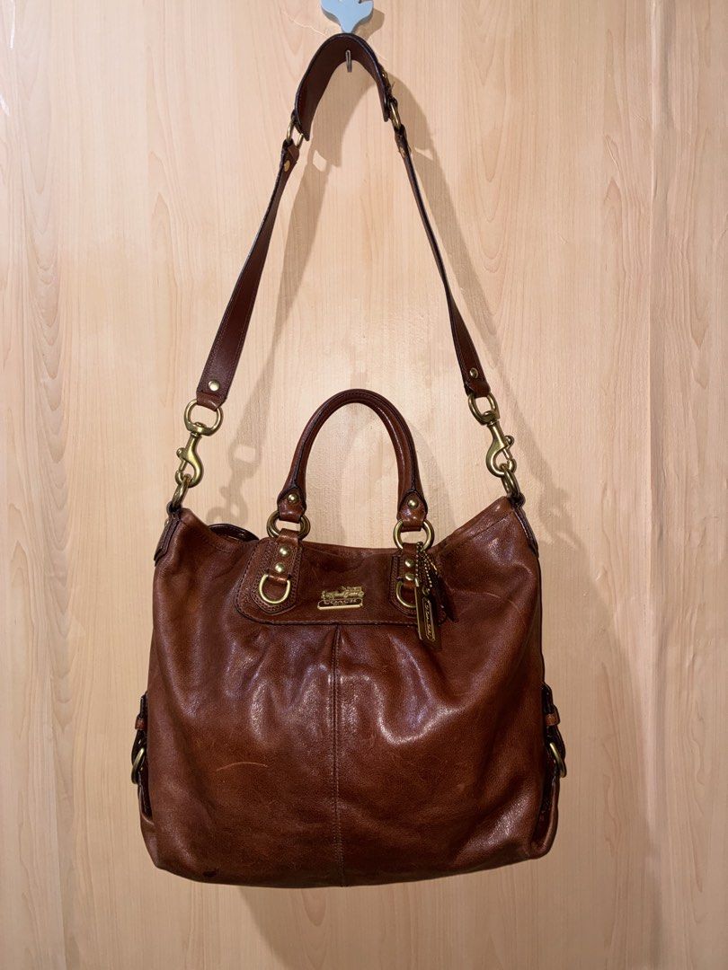 Coach Brown Leather Shoulder Bag Tote (Category: Luxury Bags & Wallets) located in Placer. Submitted by talaalond61563 (Listing ID 1471064890, Image 1). Description: - Authentic Coach Madison Julianne 2-way satchel and shoulder bag leather handbag in rich brown - Dual top handles and adjustable/removable shoulder strap - Classic brass hardware with iconic horse & carriage logo plate - Convenient exterior back zip pocket - Spacious interior with a