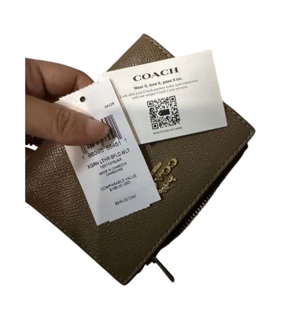 Coach Crossgrain Leather Bifold Wallet Khaki (Category: Luxury Bags & Wallets) located in Quezon City. Submitted by kcobs (Listing ID 1470983274, Image 2). Description: - Brand: Coach - Style: Bifold wallet - Material: khaki crossgrain leather - Hardware: Gold-tone - Closure: Snap closure - Compartments: Multiple card slots, cash compartment, and back zip coin pocket - Condition: Brand new with tag attached, never used, kept in storage - Retail P