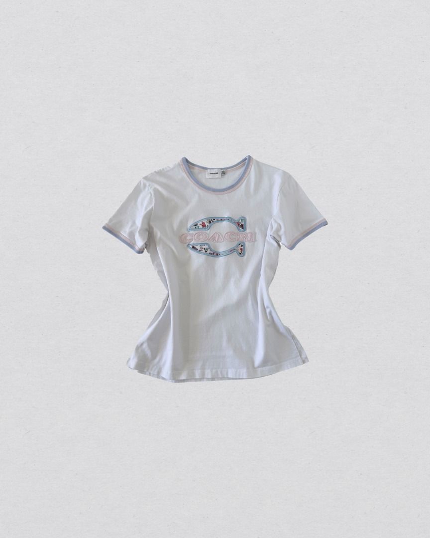 Coach Floral Patch Logo Ringer y2k shirt (Category: Shirts) located in Cabanatuan. Submitted by argarments.ph (Listing ID 1470949634, Image 1). Description: Tagged: Large on tag Width 18.5" | Length 24.5" Condition: Good condition Issue(s): Dirt stain. see photos.