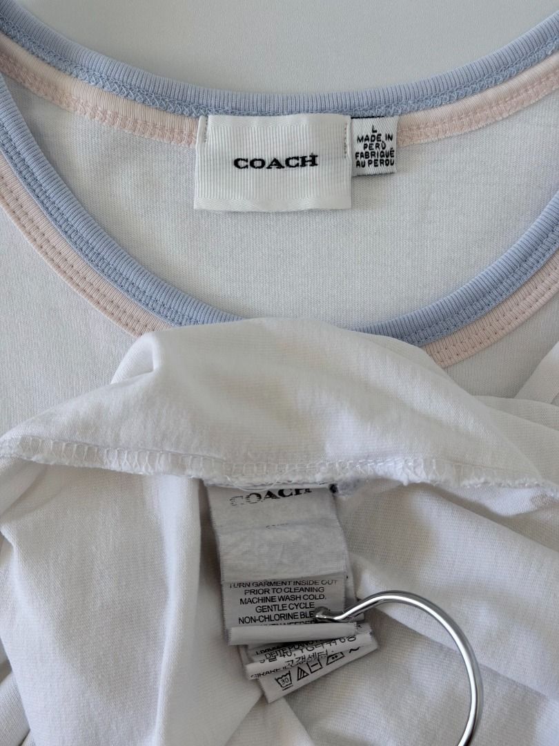Coach Floral Patch Logo Ringer y2k shirt (Category: Shirts) located in Cabanatuan. Submitted by argarments.ph (Listing ID 1470949634, Image 3). Description: Tagged: Large on tag Width 18.5" | Length 24.5" Condition: Good condition Issue(s): Dirt stain. see photos.