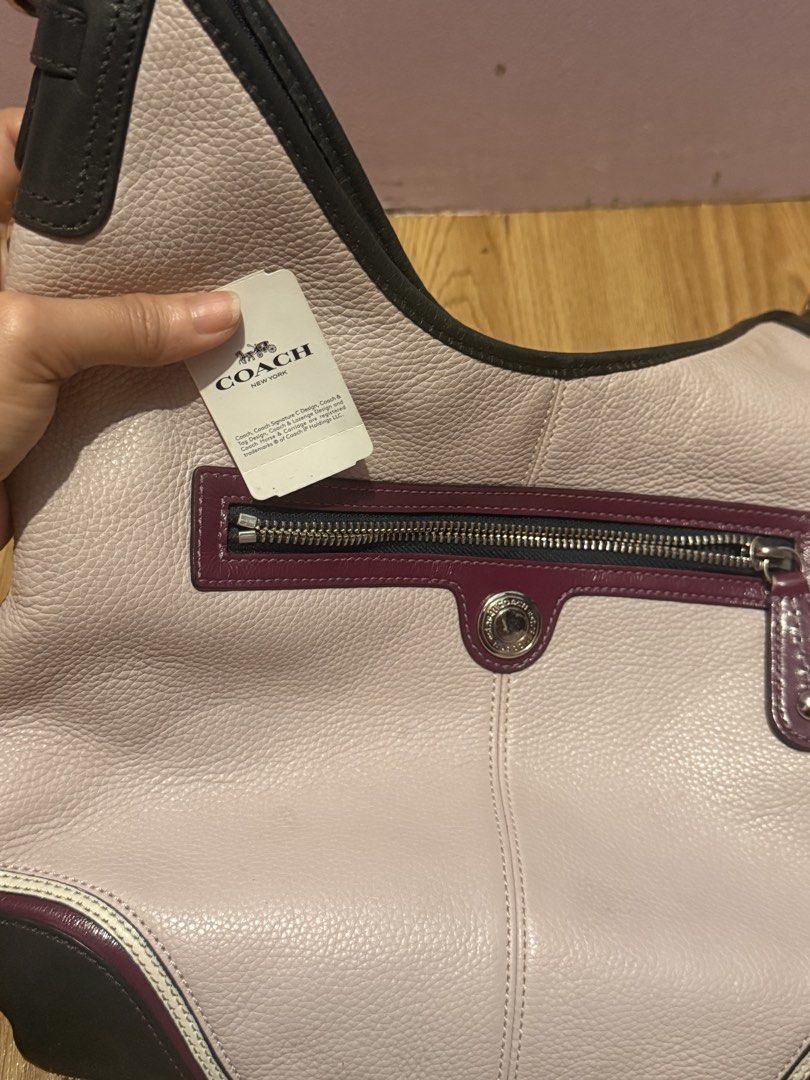 Coach Multi-Color Leather Shoulder Bag (Category: Luxury Bags & Wallets) located in Pasig City. Submitted by sea321 (Listing ID 1470941585, Image 2). Description: - Brand: Coach - Style Number: F15148 - Condition: Brand new with original $138 retail tag attached - Material: Soft milled cowhide leather - Colorway: Soft pinkish main body with dark trim and burgundy accents - Interior: Blue fabric lining with multiple pockets for organization - Exte
