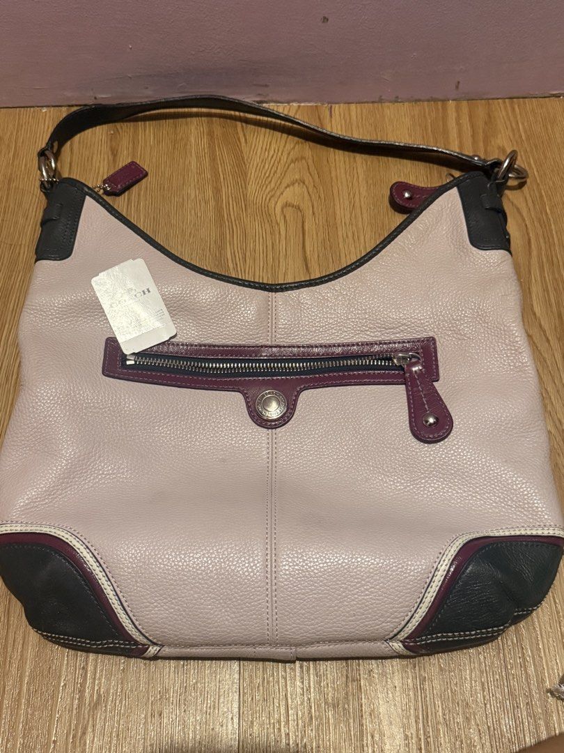 Coach Multi-Color Leather Shoulder Bag (Category: Luxury Bags & Wallets) located in Pasig City. Submitted by sea321 (Listing ID 1470941585, Image 1). Description: - Brand: Coach - Style Number: F15148 - Condition: Brand new with original $138 retail tag attached - Material: Soft milled cowhide leather - Colorway: Soft pinkish main body with dark trim and burgundy accents - Interior: Blue fabric lining with multiple pockets for organization - Exte