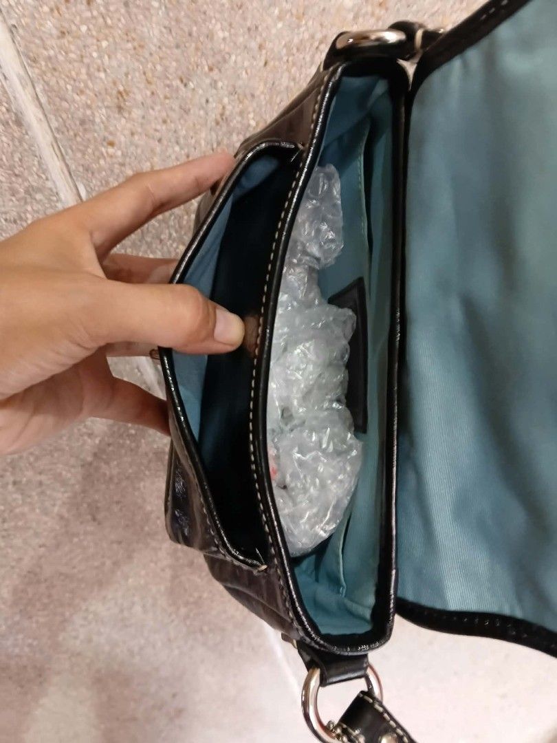 Coach Penny Flap Shoulder/Kili bag (Category: Luxury Bags & Wallets) located in Paete. Submitted by glamluxxereloved (Listing ID 1471022074, Image 3). Description: Vguc,minimal sign of usage fits big phone small wallet and essentials - Material: Black patent leather - Hardware: Silver-tone with adjustable strap - Closure: Front flap with turnlock - Interior: Clean light blue fabric lining with slip pockets and creed patch - Inclusions: Original h