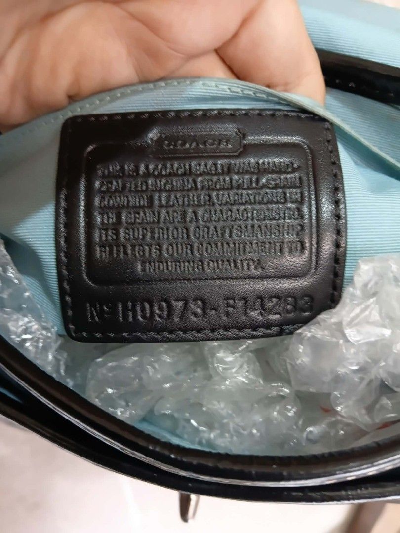 Coach Penny Flap Shoulder/Kili bag (Category: Luxury Bags & Wallets) located in Paete. Submitted by glamluxxereloved (Listing ID 1471022074, Image 2). Description: Vguc,minimal sign of usage fits big phone small wallet and essentials - Material: Black patent leather - Hardware: Silver-tone with adjustable strap - Closure: Front flap with turnlock - Interior: Clean light blue fabric lining with slip pockets and creed patch - Inclusions: Original h