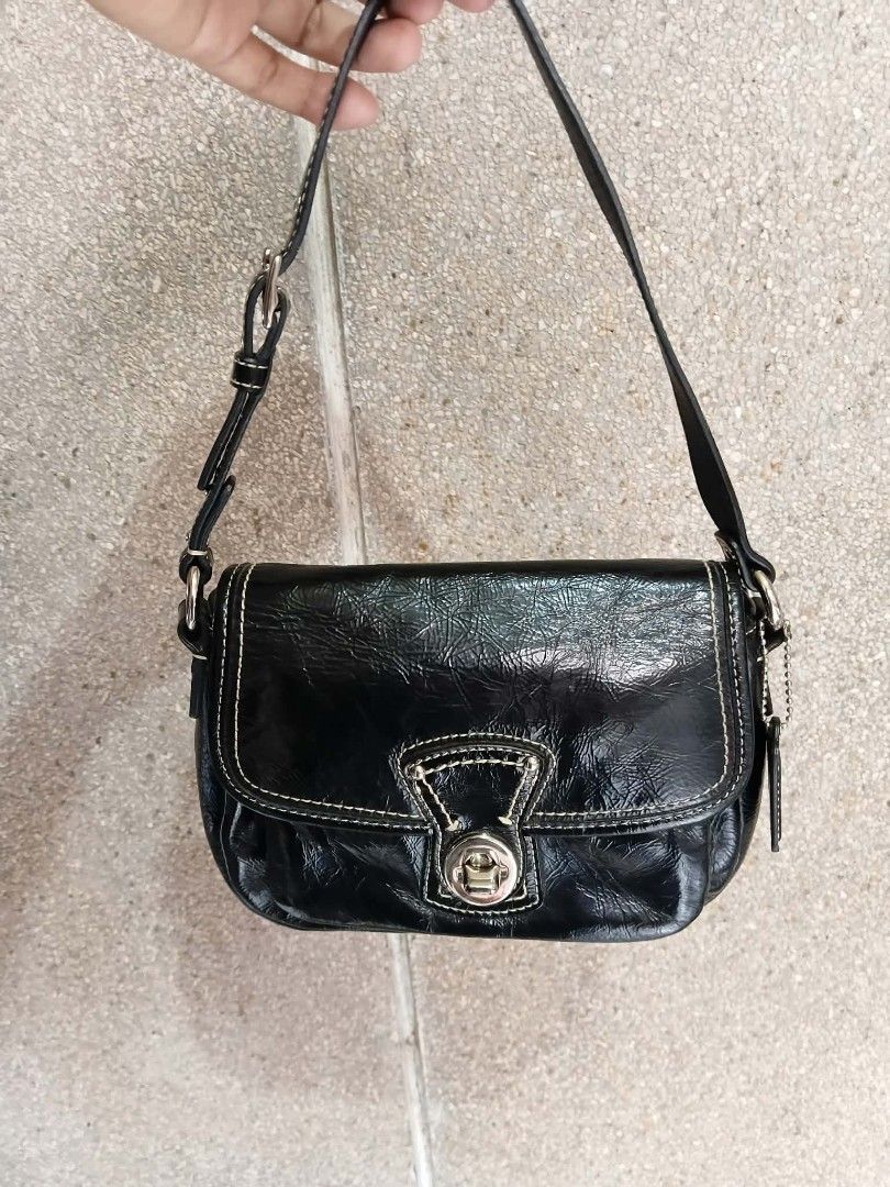 Coach Penny Flap Shoulder/Kili bag (Category: Luxury Bags & Wallets) located in Paete. Submitted by glamluxxereloved (Listing ID 1471022074, Image 1). Description: Vguc,minimal sign of usage fits big phone small wallet and essentials - Material: Black patent leather - Hardware: Silver-tone with adjustable strap - Closure: Front flap with turnlock - Interior: Clean light blue fabric lining with slip pockets and creed patch - Inclusions: Original h