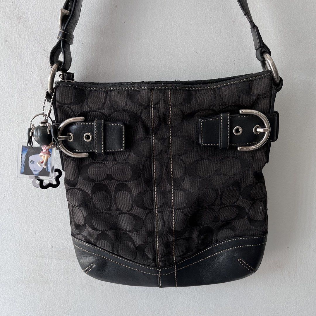 Coach Black Shoulder Bag (Category: Luxury Bags & Wallets) located in San Fernando. Submitted by souvettfrutiger (Listing ID 1470970613, Image 1). Description: Coach GF05M-3577 the issues are seen in the photos, the price is lowered because of the condition of the bag. minor rubs sa canvas not so visible when worn, rubber lining, cracks sa handle strap, no ukay smell, cleaned. -keychains not included .