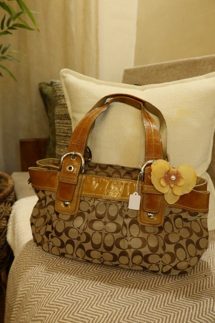 coach soho pleated (Category: Luxury Bags & Wallets) located in Arayat. Submitted by sunnydienna (Listing ID 1471060890, Image 1). Description: - Authentic Coach signature C pattern tote in tan and brown - Glossy patent leather trim and handles with stylish buckle hardware - Creed patch stamped with serial number F13742 PLEASE MANAGE YOUR EXPECTATIONS, this is a vintage bag. Has flaws hence selling low. Canvas is a 10/10 but there are flaws sa pa