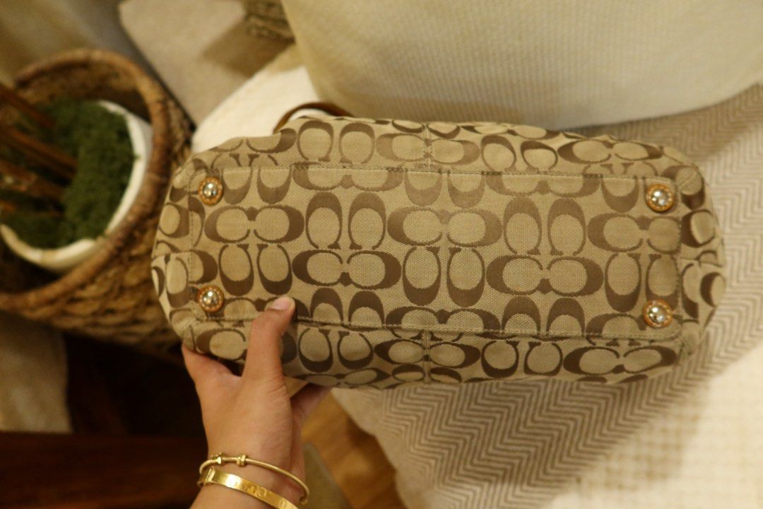 coach soho pleated (Category: Luxury Bags & Wallets) located in Arayat. Submitted by sunnydienna (Listing ID 1471060890, Image 3). Description: - Authentic Coach signature C pattern tote in tan and brown - Glossy patent leather trim and handles with stylish buckle hardware - Creed patch stamped with serial number F13742 PLEASE MANAGE YOUR EXPECTATIONS, this is a vintage bag. Has flaws hence selling low. Canvas is a 10/10 but there are flaws sa pa