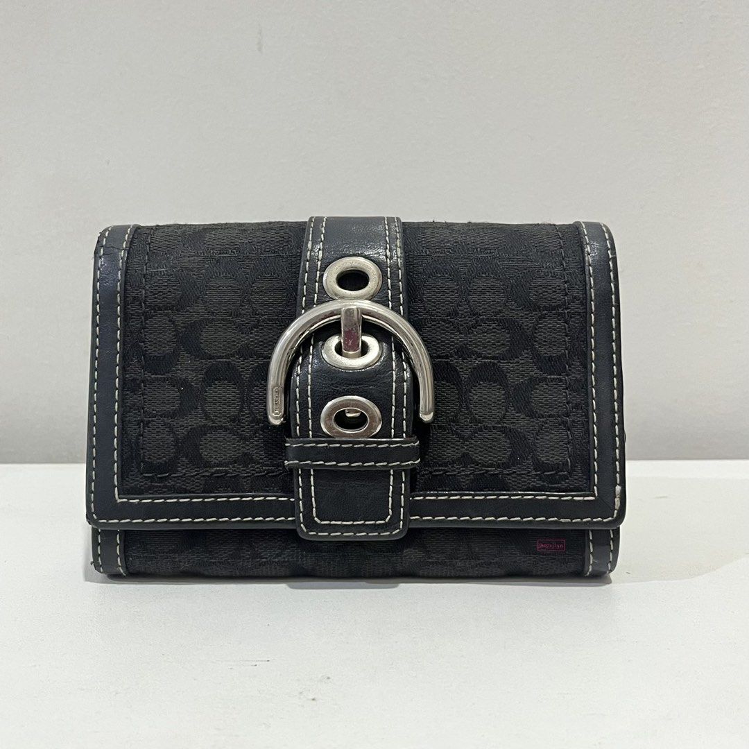 Vintage Coach Soho Wallet Triple Black (Medium) (Category: Wallets & Card holders) located in Antipolo. Submitted by shopxjlyn (Listing ID 1471028896, Image 1). Description: Coach Soho Wallet Triple Black (Medium) [Will upload more photos later hehe] Note: Photos have a pink watermark. PHP 3,500 FIXED Rank AB - YKK zipper, works well - Clean interior - Hardware has visible signs of use and scratches - Canvas has faint fading and minimal rubs - Mi