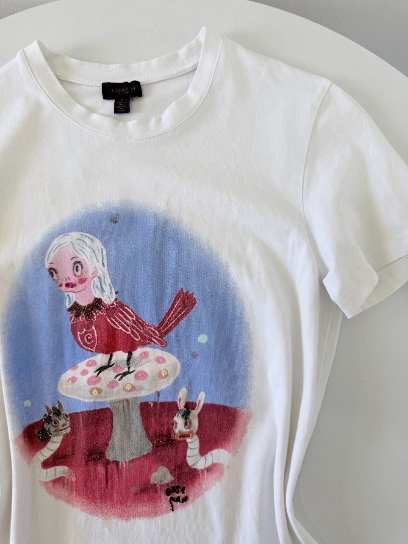 Coach x Gary Baseman Spring Collection shirt (Category: Shirts) located in Cabanatuan. Submitted by argarments.ph (Listing ID 1470940361, Image 2). Description: Tagged: Small on tag Width 17.5" | Length 25.5" Condition: Good condition Issue(s): Bit loose neckline.