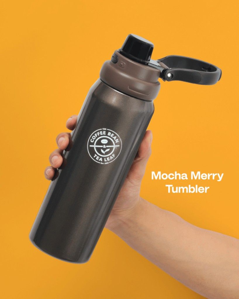 Coffee Bean & Tea Leaf Mocha Merry Tumbler (Category: Water Bottles & Tumblers) located in Manila. Submitted by couverture.mnl (Listing ID 1471098038, Image 1). Description: - Authentic The Coffee Bean & Tea Leaf Mocha Merry Tumbler (The Giving Collection) - Sleek dark brown metallic finish with brand logo - Handy black lid with an integrated carrying handle for easy portability - Excellent temperature retention for both hot and cold beverages - 