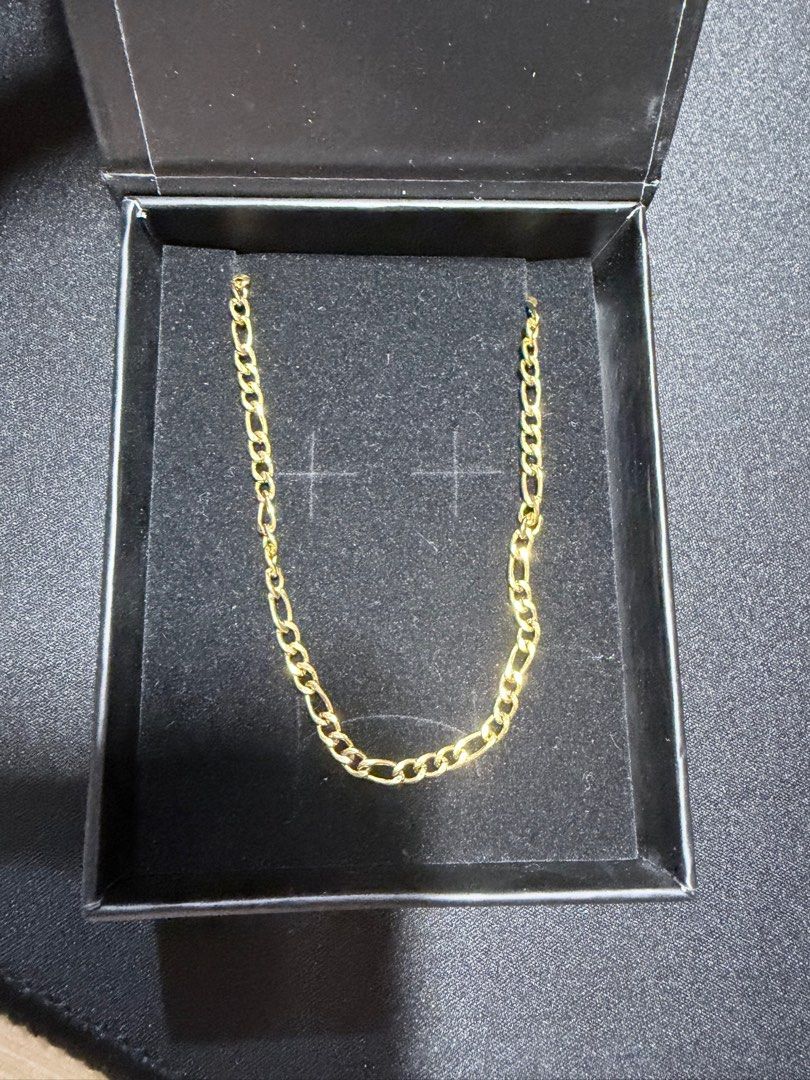 Cold Gold Slim Figaro Chain Necklace (Category: Jewelry) located in Mandaluyong City. Submitted by juliansthings (Listing ID 1471089671, Image 1). Description: - Brand: Cold Gold - Style: Gold-colored Slim Figaro link chain necklace - Vibe: Sleek urban jewelry, great for leveling up basic outfits - Condition: Clean - Inclusions: Original branded black presentation box and product insert card - Length: 20” - Width: 3mm - Material: Gold PVD Plated 