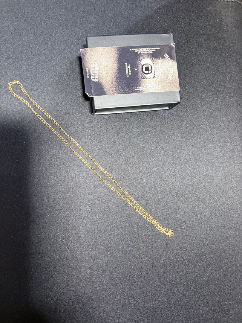 Cold Gold Slim Figaro Chain Necklace (Category: Jewelry) located in Mandaluyong City. Submitted by juliansthings (Listing ID 1471089671, Image 2). Description: - Brand: Cold Gold - Style: Gold-colored Slim Figaro link chain necklace - Vibe: Sleek urban jewelry, great for leveling up basic outfits - Condition: Clean - Inclusions: Original branded black presentation box and product insert card - Length: 20” - Width: 3mm - Material: Gold PVD Plated 