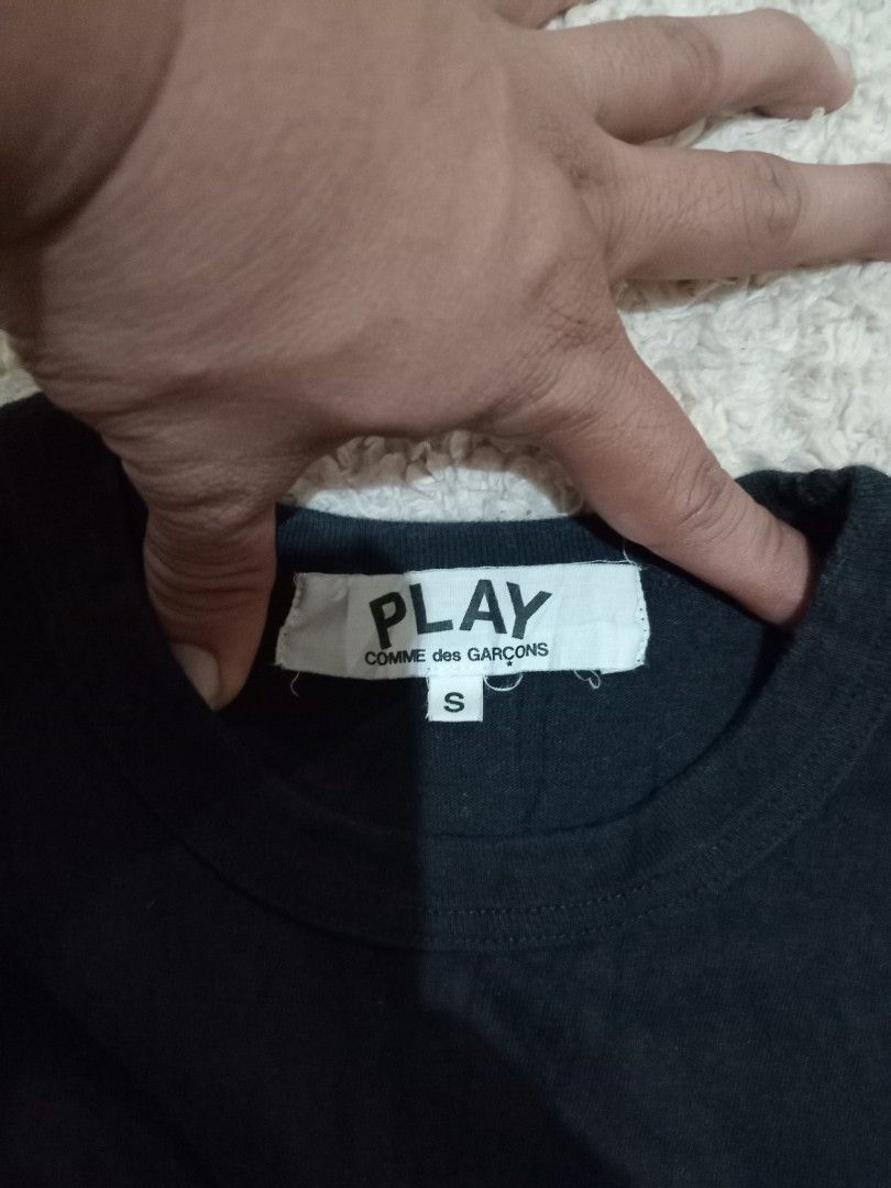 COMME des GARÇONS PLAY Tshirt (Category: Shirts) located in Tagum. Submitted by jasraggamuffin (Listing ID 1471066490, Image 2). Description: - Brand: PLAY Comme des Garçons - Color: Black - Size: S - Material: 100% Cotton - Collection: AD2017 - Details: Classic embroidered red heart patch on chest, crew neck, short sleeves - Fit: Standard fit, perfect for casual everyday wear.