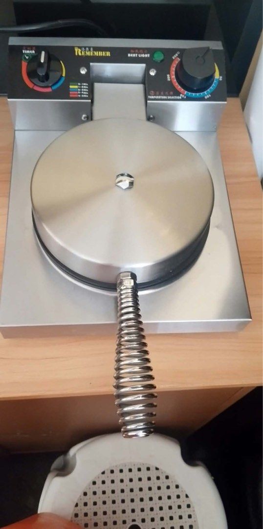 Commercial Round Waffle Maker Stainless Steel (Category: Cookware & Accessories) located in Iloilo. Submitted by clariceanyanicole (Listing ID 1471033604, Image 1). Description: - Heavy-duty commercial waffle maker - Durable stainless steel body with clean, non-stick cooking plates - Bakes 4 separate round waffle sections at once - Built-in timer dial and temperature control knob - Spring-wrapped cool-touch handle for safe baking - Fully function