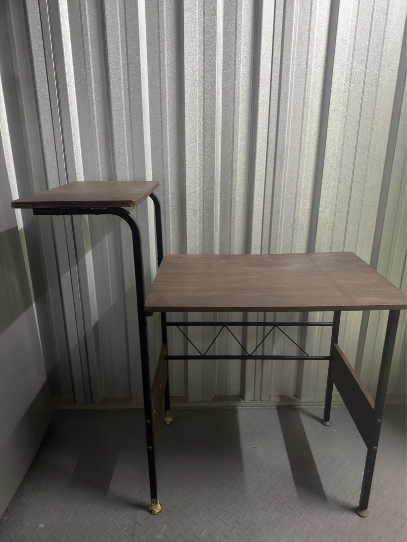 Computer table (Category: Tables & Sets) located in Consolacion. Submitted by wnpia (Listing ID 1471096421, Image 1). Description: - Dark wood grain laminate top and upper shelf - Sturdy black metal legs and crossbar support - Compact footprint, ideal for tight spaces - Upper tier perfect for holding a monitor or printer.