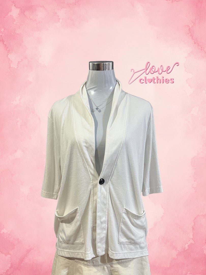 Confirm White Cardigan Size M (Category: Coats, Jackets and Outerwear) located in Tuguegarao City. Submitted by love_clothies (Listing ID 1471096365, Image 1). Description: - Brand: Confirm - Color: White - Size: M - Material: 65% polyester, 35% rayon - Closure: Single black button down the front - Pockets: Two functional front pockets - Sleeves: Half-length - Style: Clean design, perfect for easy layering.