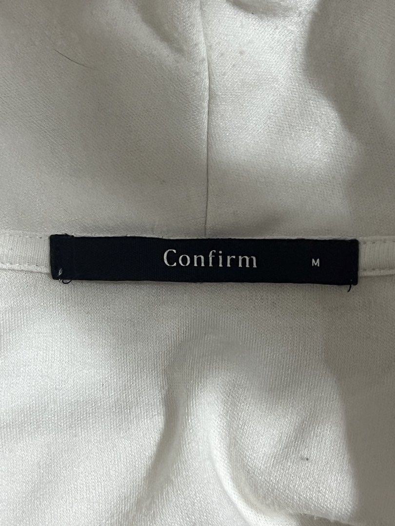Confirm White Cardigan Size M (Category: Coats, Jackets and Outerwear) located in Tuguegarao City. Submitted by love_clothies (Listing ID 1471096365, Image 3). Description: - Brand: Confirm - Color: White - Size: M - Material: 65% polyester, 35% rayon - Closure: Single black button down the front - Pockets: Two functional front pockets - Sleeves: Half-length - Style: Clean design, perfect for easy layering.