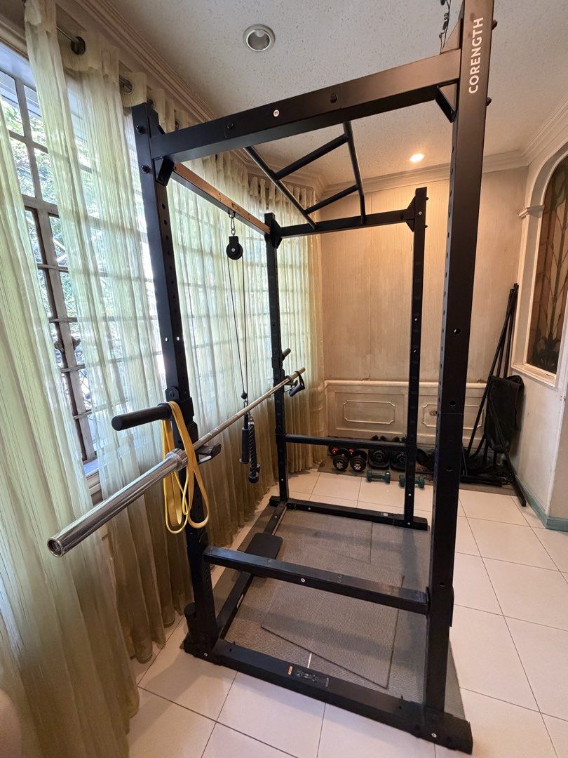 Corength Squat Rack Power Cage with Pull-up Bar and Pulley System (Category: Weights & Dumbbells) located in Pasig City. Submitted by Oniichan (Listing ID 1471004210, Image 2). Description: Selling my personal gym equipment, barely used and good as new pa. ₱40,000 FOR THE WHOLE SET (NEGOTIABLE): •Corength Power Rack bought from Decathlon for ₱40,000 • AB-2 Adjustable Bench bought from MATTE FITNESS for ₱11,000 • 20kg Olympic Bar bought from MATTE