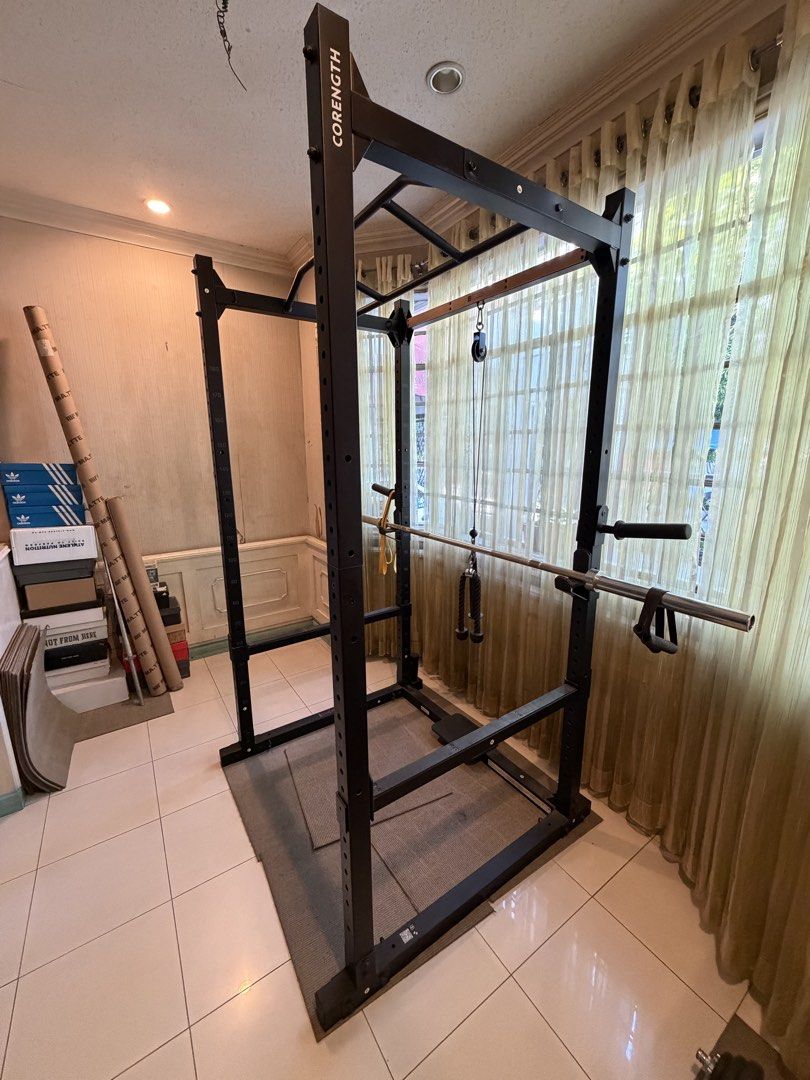 Corength Squat Rack Power Cage with Pull-up Bar and Pulley System (Category: Weights & Dumbbells) located in Pasig City. Submitted by Oniichan (Listing ID 1471004210, Image 3). Description: Selling my personal gym equipment, barely used and good as new pa. ₱40,000 FOR THE WHOLE SET (NEGOTIABLE): •Corength Power Rack bought from Decathlon for ₱40,000 • AB-2 Adjustable Bench bought from MATTE FITNESS for ₱11,000 • 20kg Olympic Bar bought from MATTE