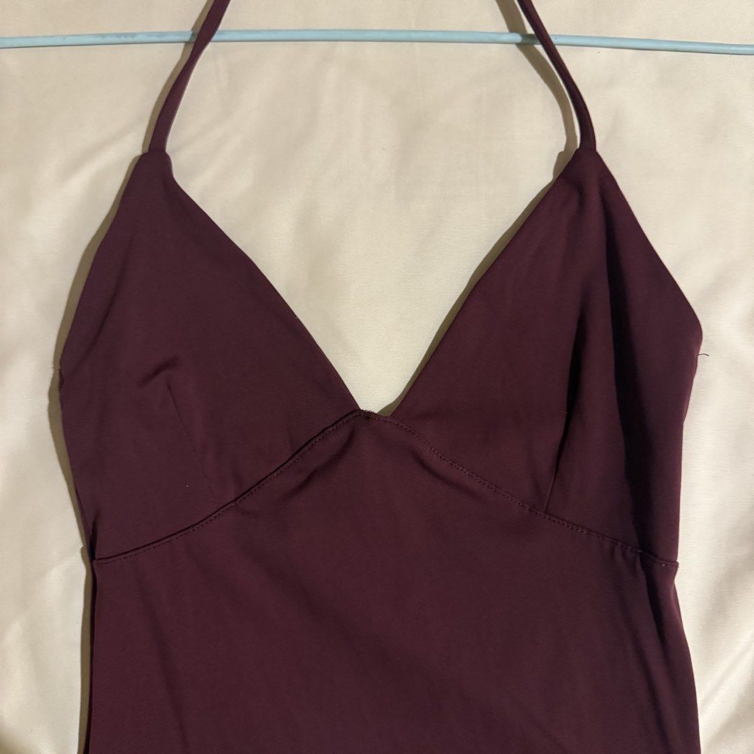 Cotton On Maroon Halter Top Size S (Category: Sleeveless) located in Quezon City. Submitted by s0l4nge (Listing ID 1471067340, Image 2). Description: - Brand/Item: Cotton On Maroon Halter Top - Size: S - Design: Deep V-neckline with halter straps, smooth fabric, snug fit - Condition: Barely worn, stored properly, clean inside and out - Versatility: Perfect basic piece for layering or going out - Also available in black and brown.