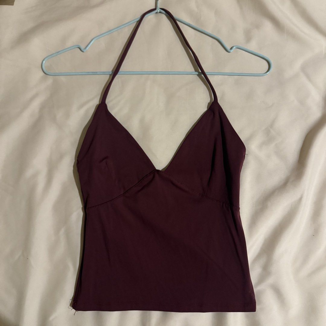 Cotton On Maroon Halter Top Size S (Category: Sleeveless) located in Quezon City. Submitted by s0l4nge (Listing ID 1471067340, Image 1). Description: - Brand/Item: Cotton On Maroon Halter Top - Size: S - Design: Deep V-neckline with halter straps, smooth fabric, snug fit - Condition: Barely worn, stored properly, clean inside and out - Versatility: Perfect basic piece for layering or going out - Also available in black and brown.