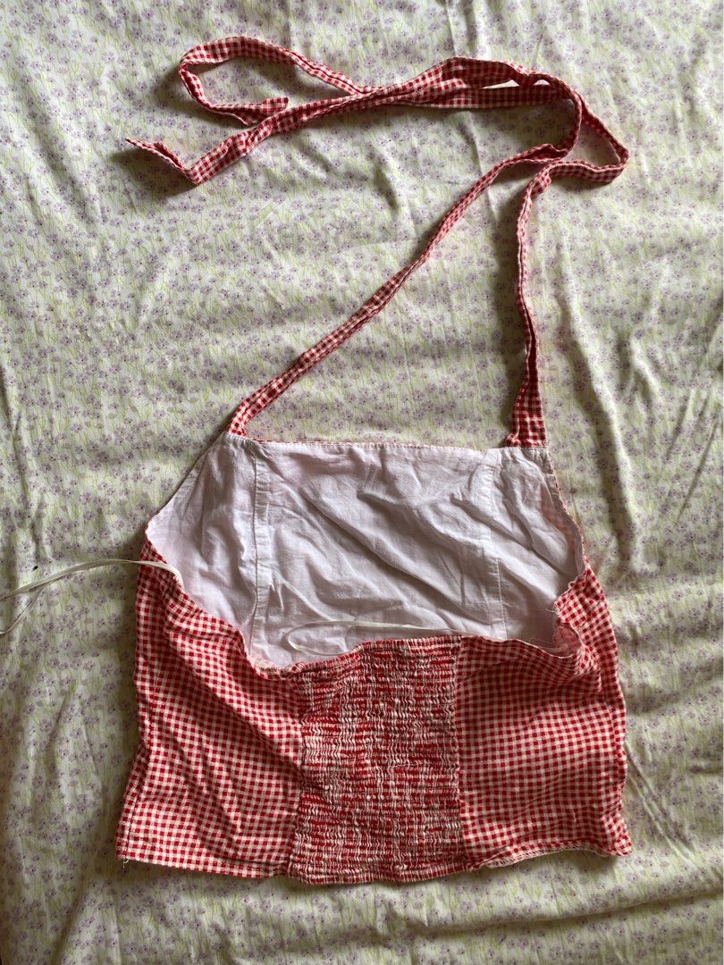 Cotton On Red Gingham Check Halter Top Size 10 (Category: Sleeveless) located in Quezon City. Submitted by damclothings.ph (Listing ID 1470951116, Image 2). Description: - Brand: Cotton On - Size: 10 AU / 6 US - Color/Pattern: Red and white gingham - Style: Halter neck with tie straps, smocked back panel, cropped fit - Material: Lightweight fabric - Condition: Great for warm weather and casual outings.