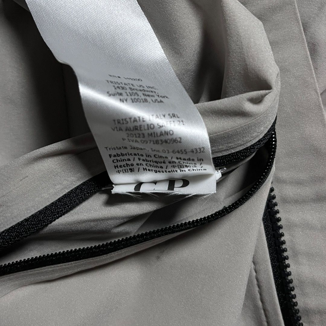 C.P. Company Pro-Tek Bomber Jacket Grey (Category: Coats, Jackets and Outerwear) located in Caloocan City. Submitted by achilles_grails (Listing ID 1471051093, Image 3). Description: - Brand: C.P. Company - Model: Pro-Tek Technical Jacket - Color: Light grey with black zippers and pull tabs - Storage: Multiple secure zipped pockets on chest, body, and sleeve - Closure: Full front zip - Details: Signature branding tags stitched inside near the col
