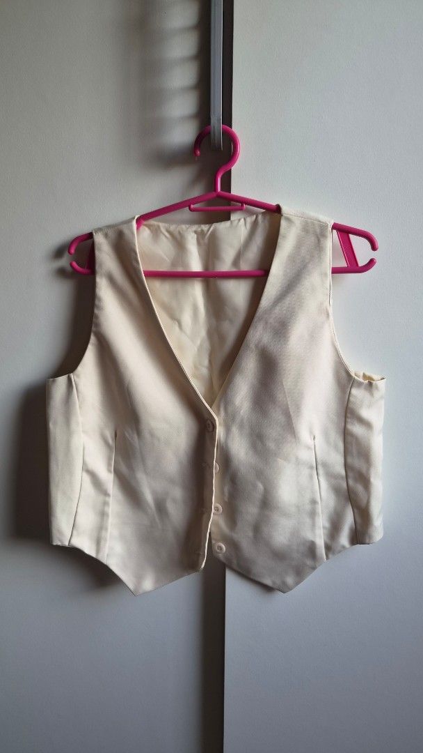 Cream Tailored Waistcoat Vest (Category: Others Tops) located in Manila. Submitted by drc.tpwk77 (Listing ID 1470973502, Image 1). Description: - Color: Neutral cream - Fit: Structured and tailored - Details: Front button closure, faux chest pockets - Lining: Fully lined for comfort - Styling: Great layering piece for smart casual or formal outfits.