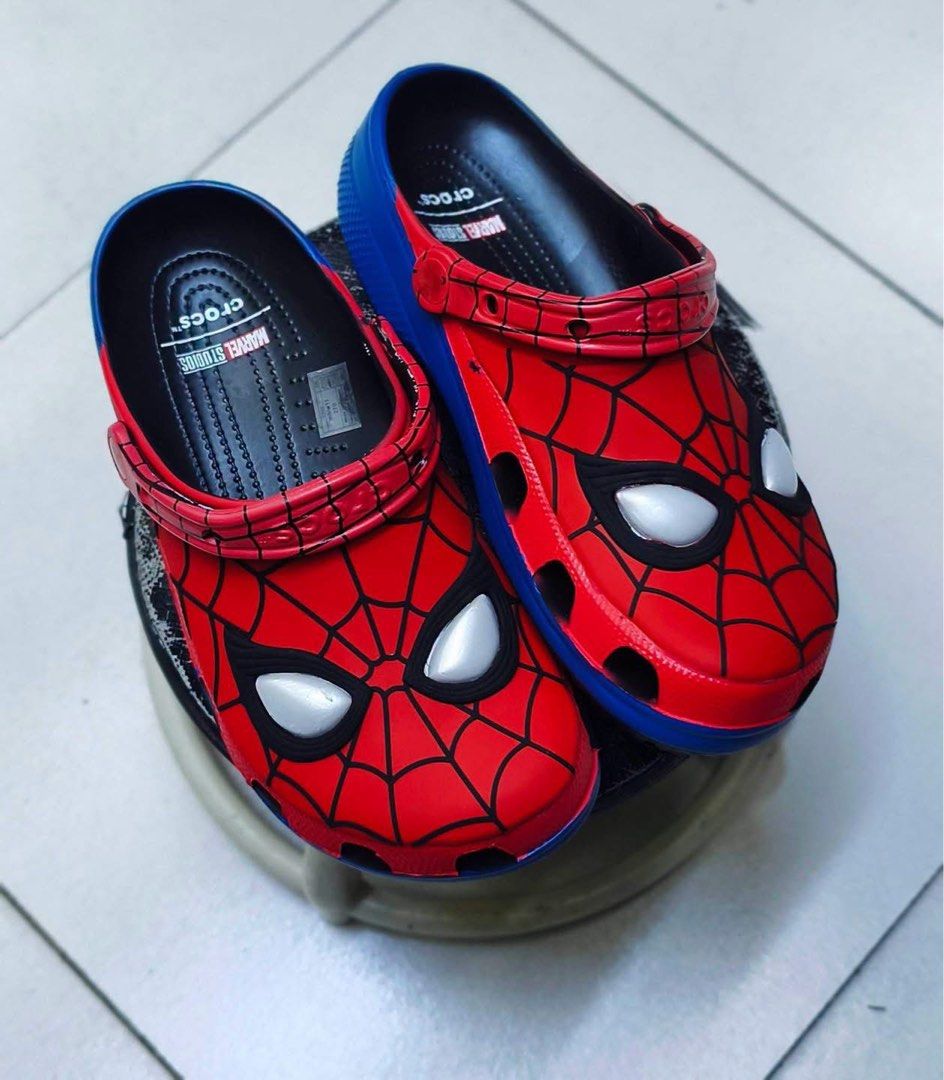 Crocs Classic X Marvel ‘Spiderman’ (Category: Slippers & Slides) located in Manila. Submitted by collectorfinds (Listing ID 1471028740, Image 2). Description: “SUIT UP. STAND OUT.” 🕷️🕸️ Crocs Classic X Marvel ‘Spiderman’ Men’s US Size 7 / 8 For Only ✅ ₱ 6,895 📩 PM us to purchase 📍2nd Floor, 317 Fernando Poe Jr Ave . Quezon City. Right above Yamaha near LRT 1 - Roosevelt Station. 📈 Prices subject to change without notice.