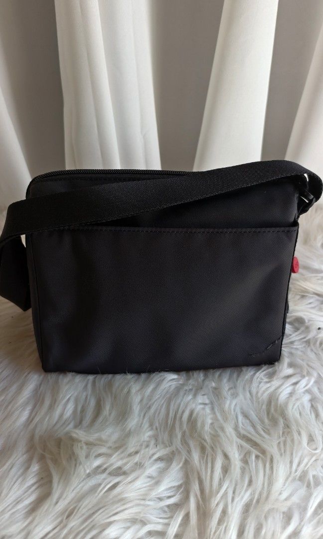 Crossing bodybag (Category: Cross-body Bags) located in General Santos City (Dadiangas). Submitted by zhia_preloved (Listing ID 1470990330, Image 3). Description: new, 💯 Original issues details on pic kindly check back of the bag lower part.