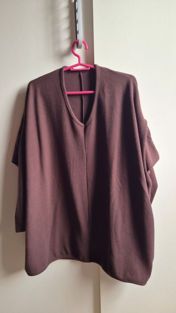Dark Brown V-Neck Blouse/ Sweater (Category: Blouses) located in Manila. Submitted by drc.tpwk77 (Listing ID 1470968246, Image 1). Description: - Color: Dark brown - Design: Long-sleeve with a trendy slit neckline and textured weave - Fit: Comfortable relaxed fit, great for casual days and travel - Condition: Worn only once during a trip to Korea - Styling: Pairs easily with jeans or wide-leg trousers.