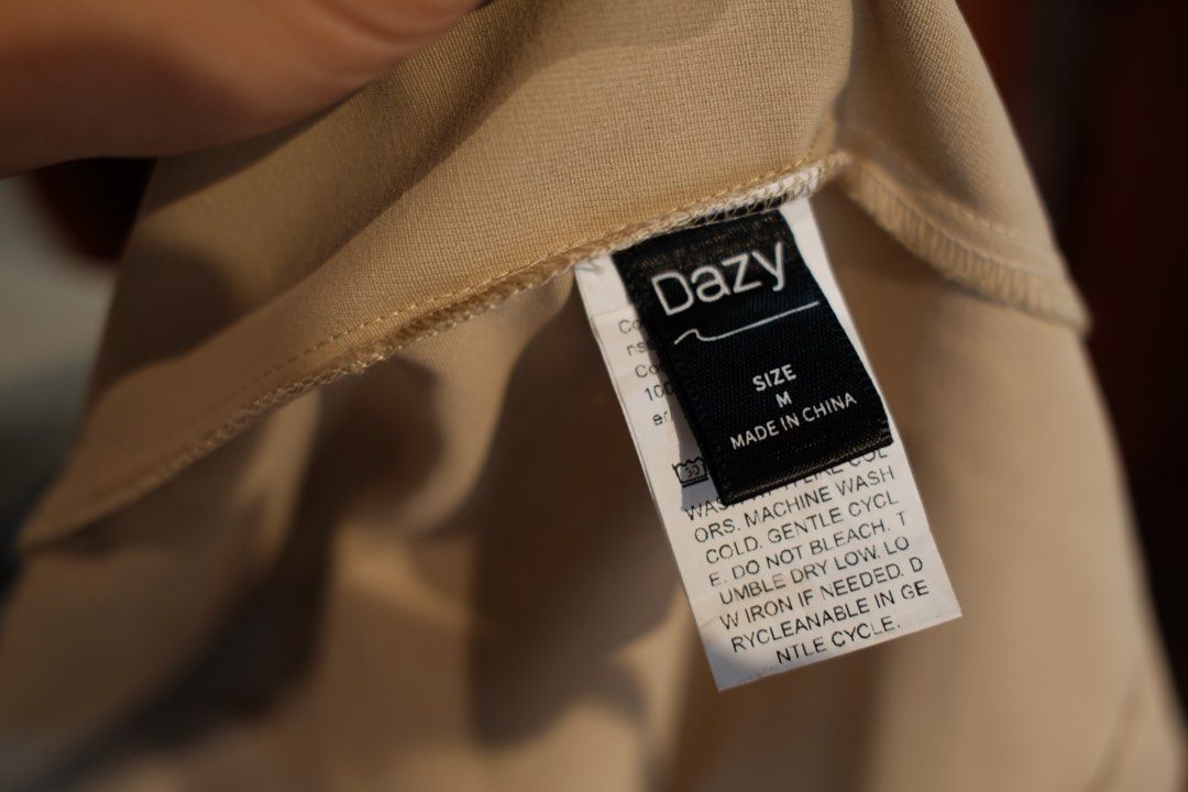 Dazy Beige Oversized Trench Coat Size M (Category: Coats, Jackets and Outerwear) located in Makati City. Submitted by nomoreclutterph (Listing ID 1471037515, Image 3). Description: - Brand: Dazy - Size: Medium (tag attached) - Color: Classic Beige - Style: Long midi length, draped lapels, relaxed drop shoulders, buttonless open front - Material: Lightweight fabric, ideal for layering - Condition: Clean, ready to wear - Can fit size Medium to Larg