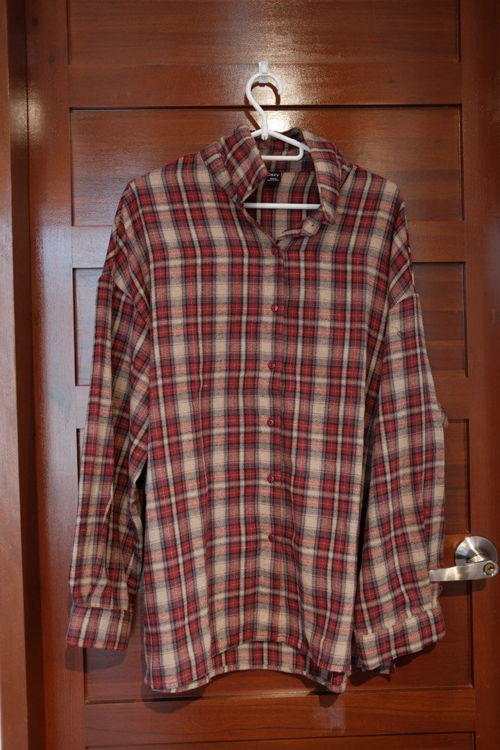 Dazy Red Plaid Button Up Shirt Size M (Category: Shirts) located in Makati City. Submitted by nomoreclutterph (Listing ID 1471037710, Image 1). Description: - Brand: Dazy - Size: Medium - Color/Pattern: Red and beige plaid - Material: Soft flannel - Fit: Loose, oversized - Features: Classic collar, front buttons, buttoned cuffs - Condition: Clean, great layering piece.