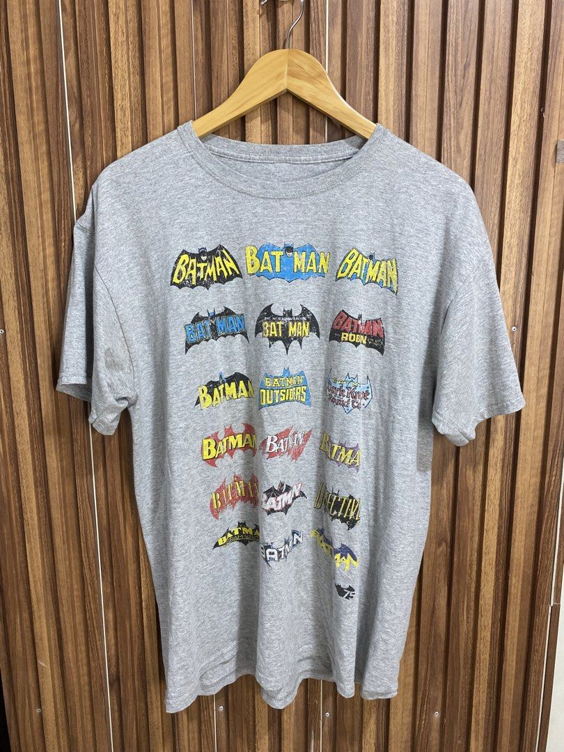 DC Comics Batman Logo Evolution Graphic T-Shirt Gray Size L (Category: Tshirts & Polo Shirts ) located in Caloocan City. Submitted by heatedcaps4425 (Listing ID 1471098524, Image 1). Description: - Official DC Comics Originals merchandise - Gray graphic tee featuring various Batman logo iterations and titles - Size: Large (Made in Honduras) - Material: Comfortable cotton fabric blend - Design: Crew neckline and short sleeves - Condition: Clean ov