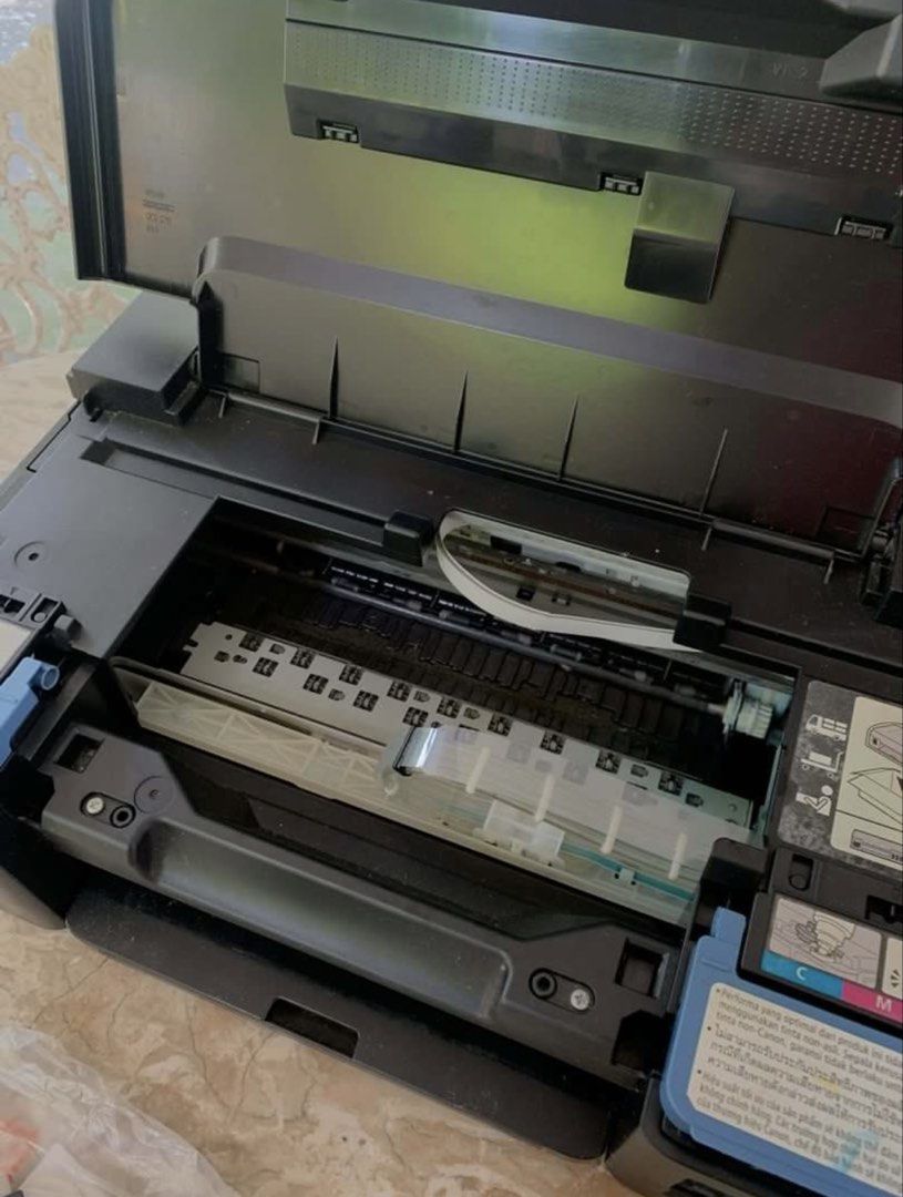 DEFECTIVE PIXMA Printer G1010 (Category: Printers, Scanners & Copiers) located in Manila. Submitted by stainedpawsapothecary (Listing ID 1470966526, Image 1). Description: - Model: Canon printer in a sleek black finish - Features: Open-top scanner lid and easy-to-see right-side ink tanks DEFECTIVE PO. Hindi ko siya nagamit, bought it here too. Dumating sa akin, hindi na pala gumagana. According to technicians, need palitan ng motherboard. .