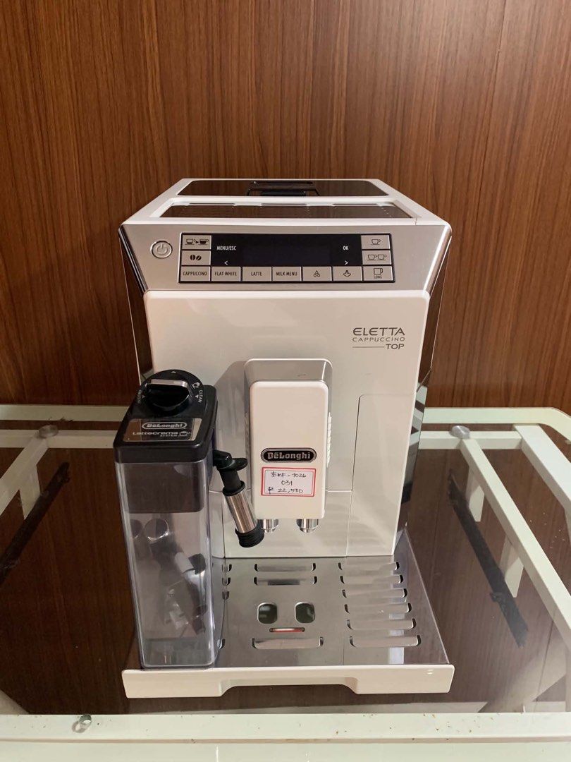 DeLonghi Eletta Cappuccino Top Espresso Machine (Category: Coffee Machines & Makers) located in Pulilan. Submitted by sebbii (Listing ID 1470963807, Image 1). Description: - Authentic DeLonghi Eletta Cappuccino Top espresso maker - Elegant white and silver finish - Includes LatteCrema milk carafe attachment - Digital display panel with one-touch buttons for cappuccino, flat white, latte, and long coffee - Comes complete with drip tray and spouts 