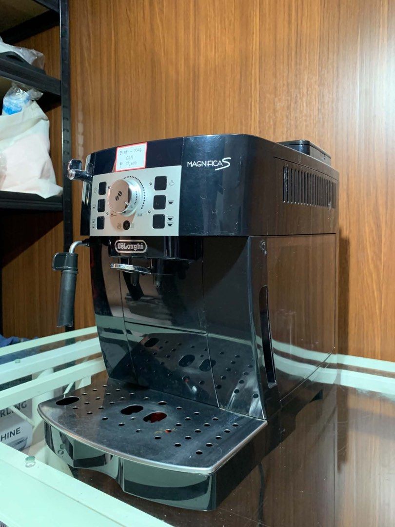 DeLonghi Magnifica S Espresso Coffee Machine Black (Category: Coffee Machines & Makers) located in Pulilan. Submitted by sebbii (Listing ID 1470959997, Image 2). Description: - Model: DeLonghi Magnifica S bean-to-cup coffee machine - Color: Sleek black with a silver control panel - Features: Rotary dial for coffee strength, push buttons for cup sizes, and built-in steam wand for milk frothing - Condition: Powers up and works smoothly, thoroughly 