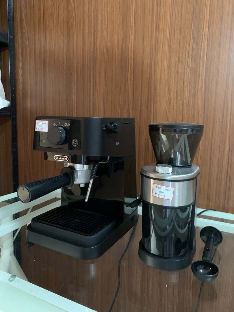 Delonghi stilosa Espresso Machine and Coffee Grinder Set (Category: Coffee Machines & Makers) located in Pulilan. Submitted by sebbii (Listing ID 1470962316, Image 3). Description: - Complete home coffee setup: DeLonghi espresso machine and matching electric grinder - Includes portafilter, drip tray, clear-hopper grinder, and black coffee scoop - Tested and working properly - Sleek black design with silver accents - Ready for your daily morning r