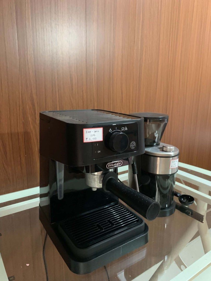 Delonghi stilosa Espresso Machine and Coffee Grinder Set (Category: Coffee Machines & Makers) located in Pulilan. Submitted by sebbii (Listing ID 1470962316, Image 2). Description: - Complete home coffee setup: DeLonghi espresso machine and matching electric grinder - Includes portafilter, drip tray, clear-hopper grinder, and black coffee scoop - Tested and working properly - Sleek black design with silver accents - Ready for your daily morning r