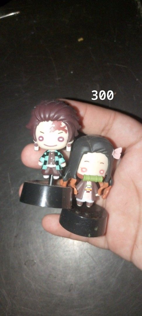 Demon Slayer Figures and Plushies Assorted Collection (Category: Plushies & Soft Toys) located in Manila. Submitted by mika0430lovesshopping (Listing ID 1470999517, Image 2). Description: - Anime merchandise declutter sale - Items include Demon Slayer plush toys, Tanjiro & Nezuko mini figures on black bases, and Giyu Tomioka figures (various sizes) - Individual item prices range from ₱200 to ₱1,200 - Perfect additions for anime display shelves - 