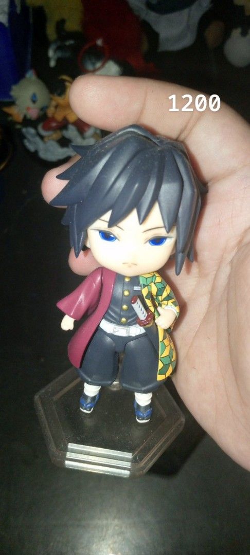Demon Slayer Figures and Plushies Assorted Collection (Category: Plushies & Soft Toys) located in Manila. Submitted by mika0430lovesshopping (Listing ID 1470999517, Image 3). Description: - Anime merchandise declutter sale - Items include Demon Slayer plush toys, Tanjiro & Nezuko mini figures on black bases, and Giyu Tomioka figures (various sizes) - Individual item prices range from ₱200 to ₱1,200 - Perfect additions for anime display shelves - 