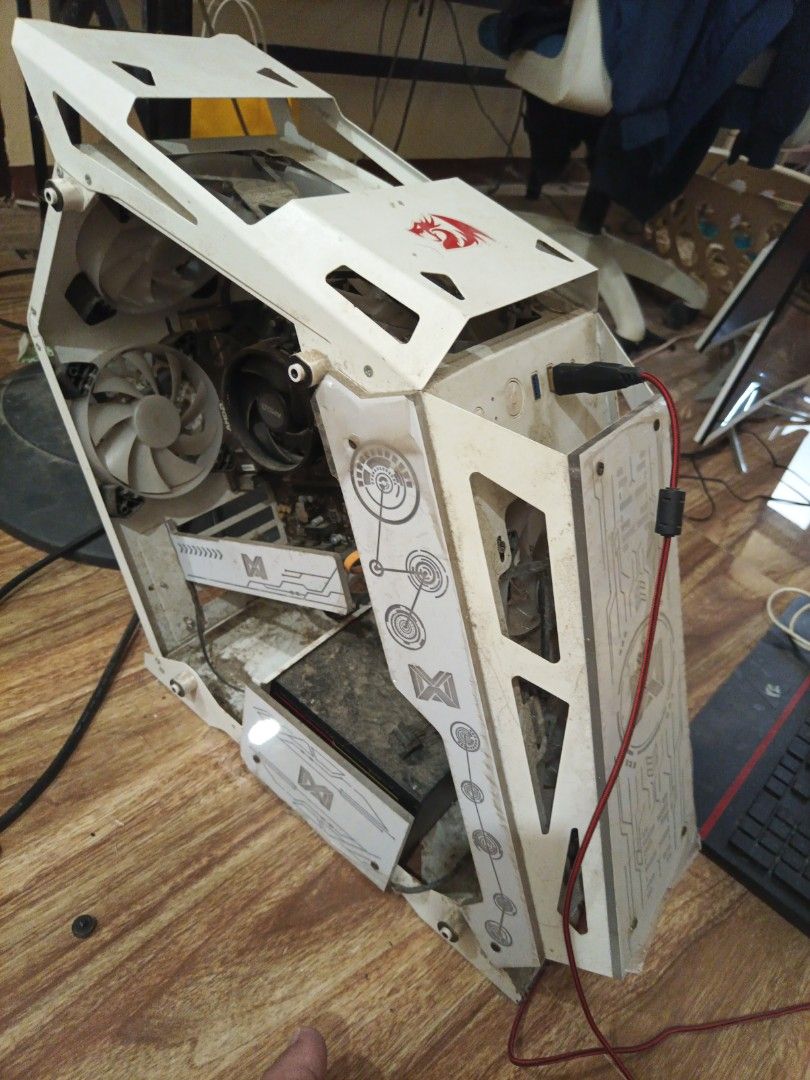 Defective Desktop Gaming PC (Category: Desktops) located in Tanza. Submitted by raphgex15 (Listing ID 1470956315, Image 1). Description: RUSH!!! - Custom white gaming PC case for DIY builders - Features front panel graphics and top I/O ports with USB - Condition: Heavy dust and grime; requires cleaning - Sold as-is, great restoration project Selling this defective PC, which I believe can still be fixed. I bought this 3 years ago for 19k. It just 